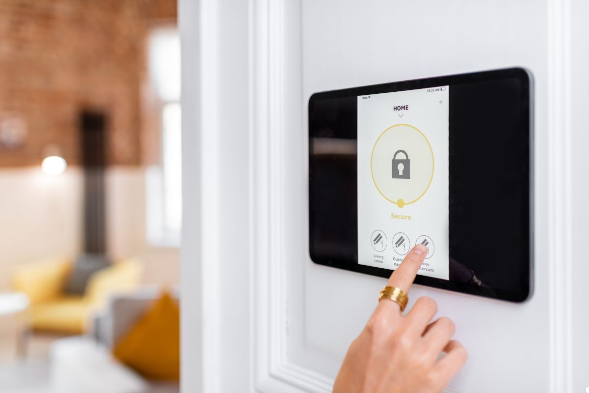 A person interacts with a smart home device, adjusting settings with a touch on its sleek surface.