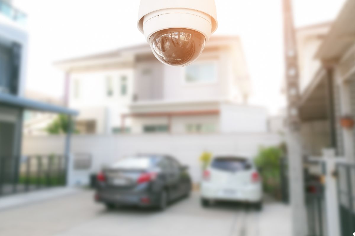A security camera mounted in front of a house, monitoring the entrance for safety and surveillance purposes.